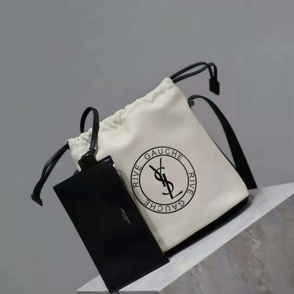 Saint Laurent YSL Rive Gauche Laced Bucket Bag in Smooth Leather for Men in Beige