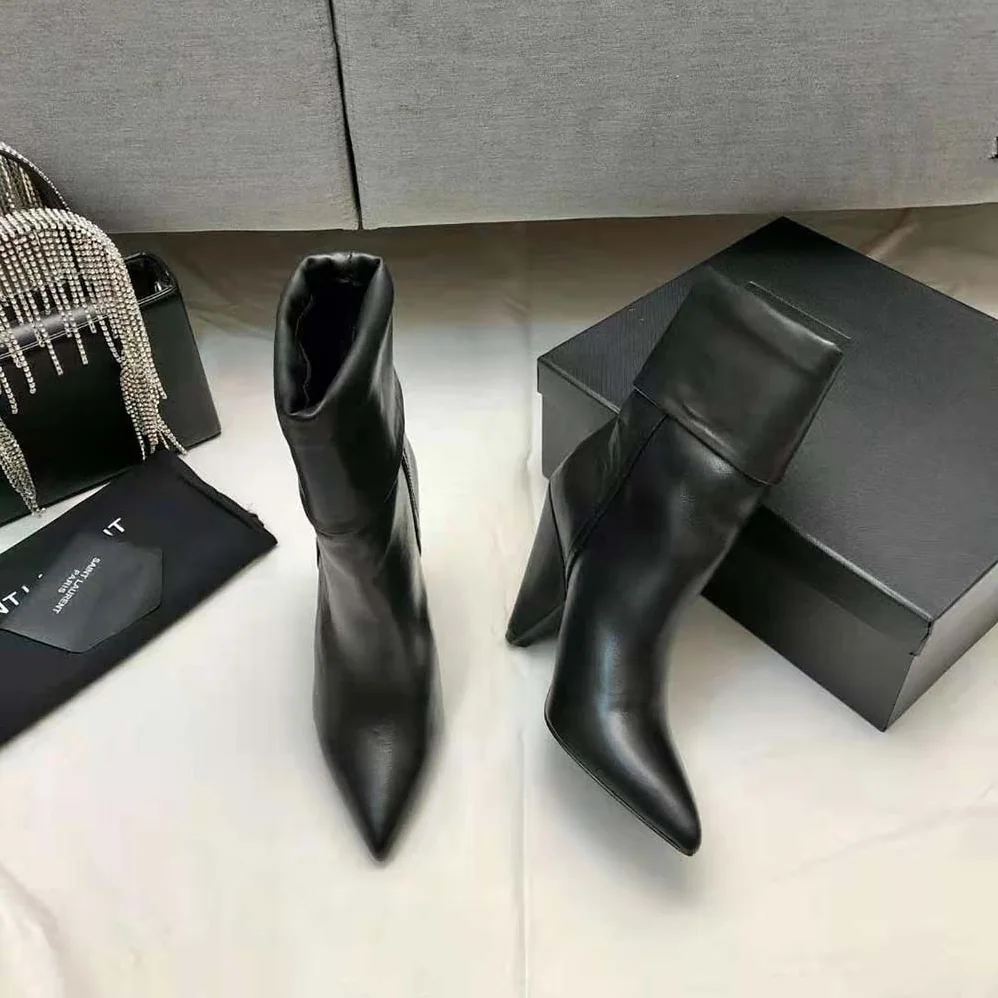 Saint Laurent YSL Niki Booties in Smooth Leather and Silver-Tone Monogram for Women in Black Saint Laurent YSL Niki Booties in Smooth Leather and Silver-Tone Monogram for Women in Black