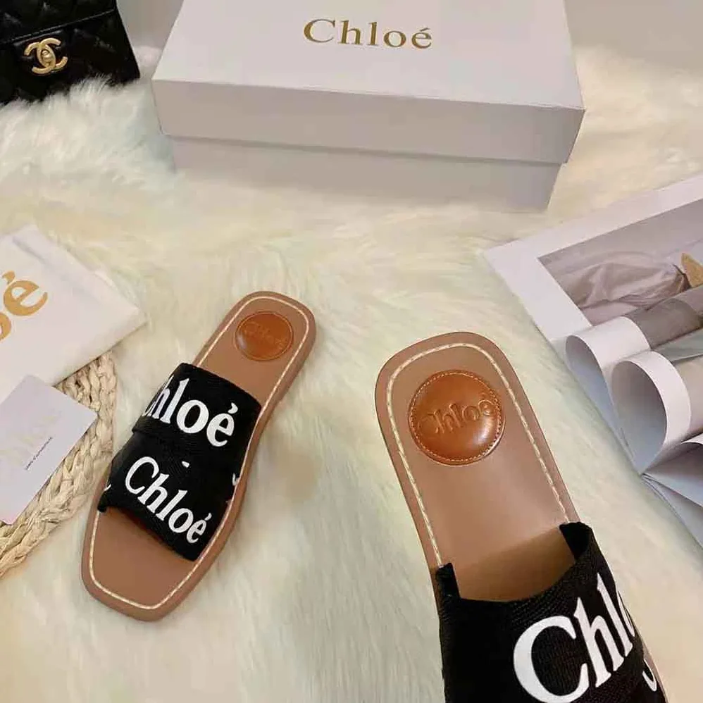 Chloe Woody Flat Mule in Canvas for Women in Black Chloe Woody Flat Mule in Canvas for Women in Black