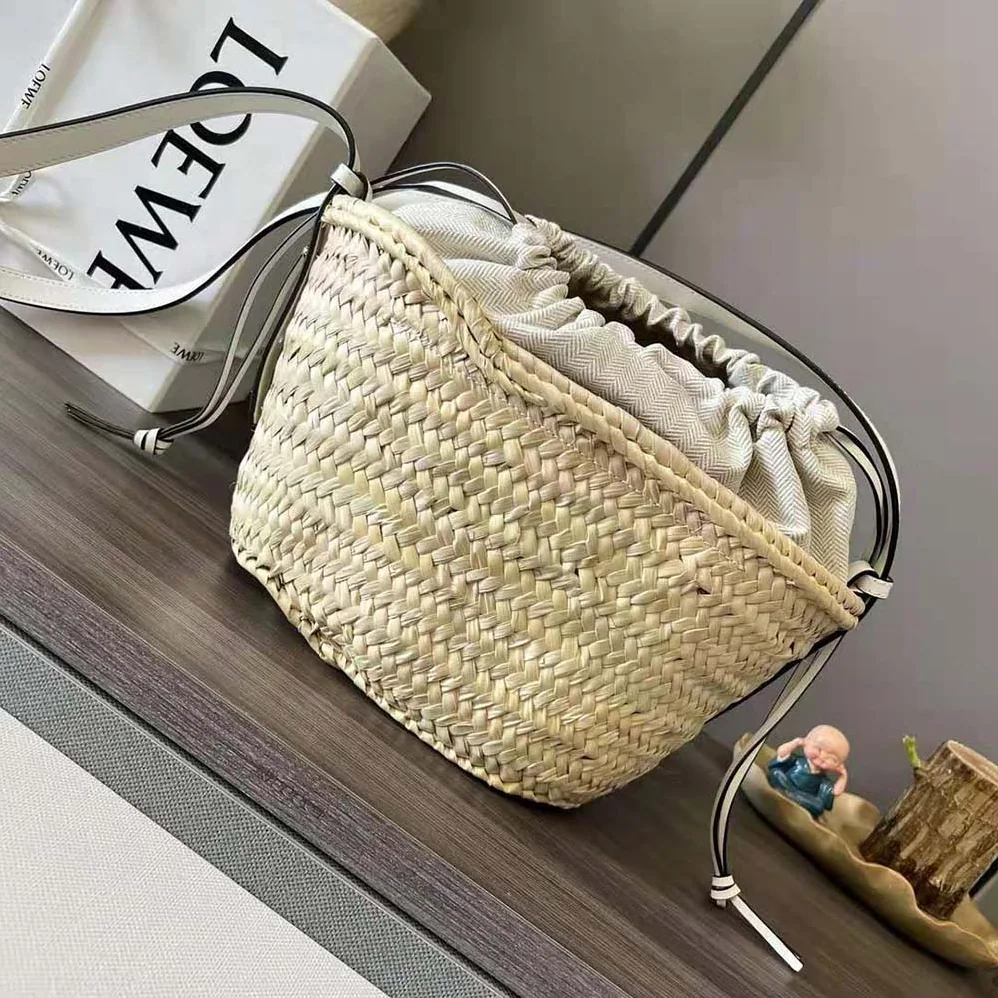 Loewe Drawstring Bucket Bag in Palm Leaf and Calfskin for Women in White Loewe Drawstring Bucket Bag in Palm Leaf and Calfskin for Women in White