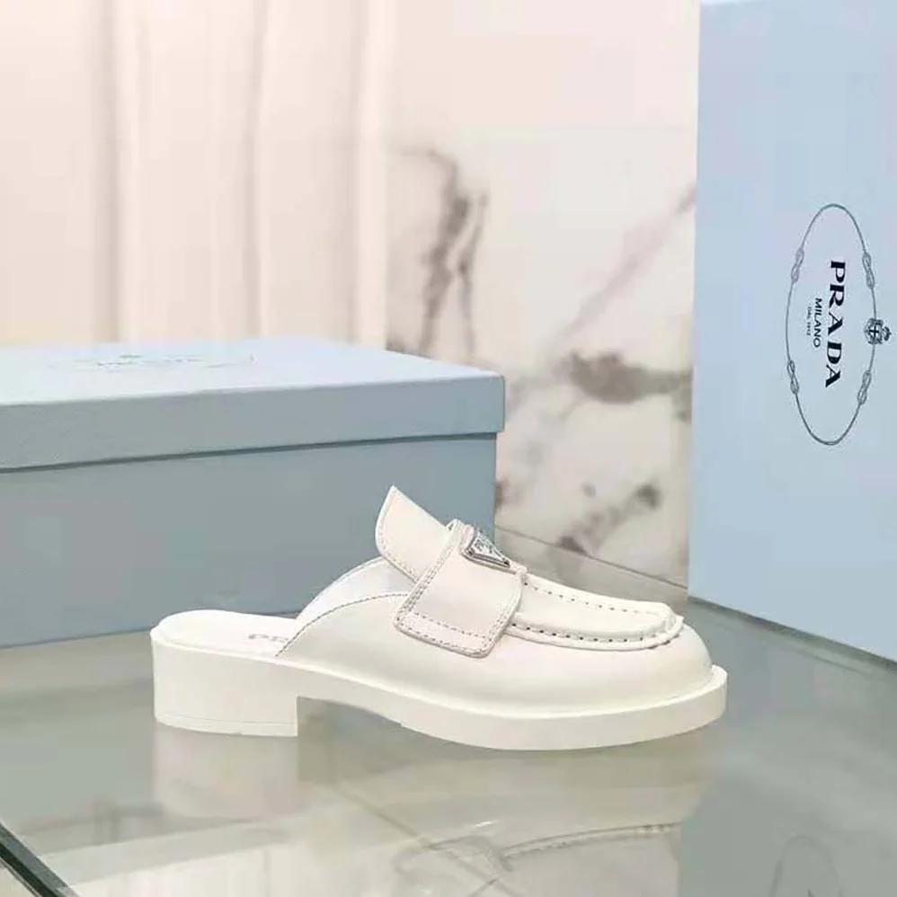 Prada Chocolate Brushed Leather Mules for Women in White Prada Chocolate Brushed Leather Mules for Women in White