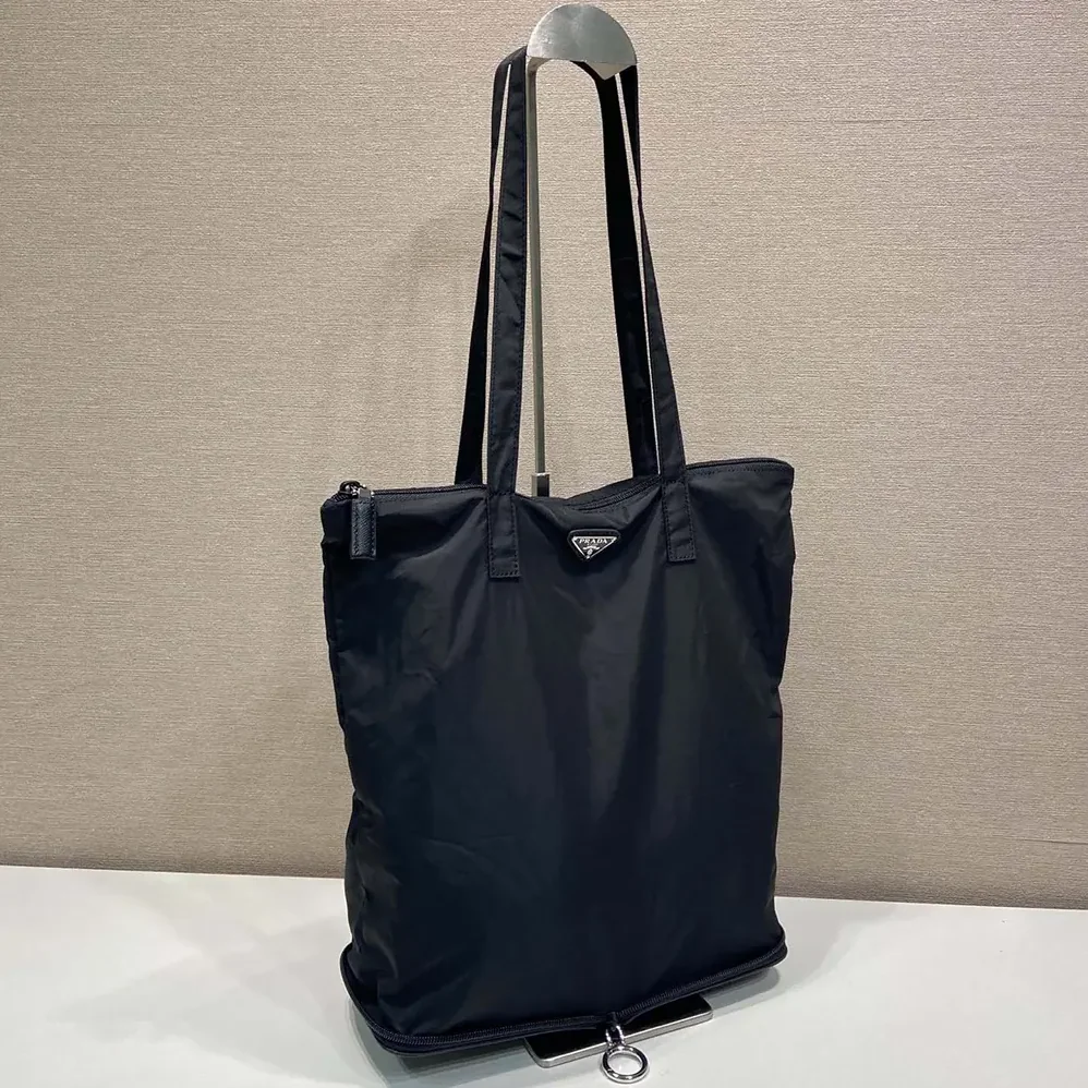 Prada Saffiano Leather Pendant With Re-Nylon Tote Bag for Women in Black Prada Saffiano Leather Pendant With Re-Nylon Tote Bag for Women in Black