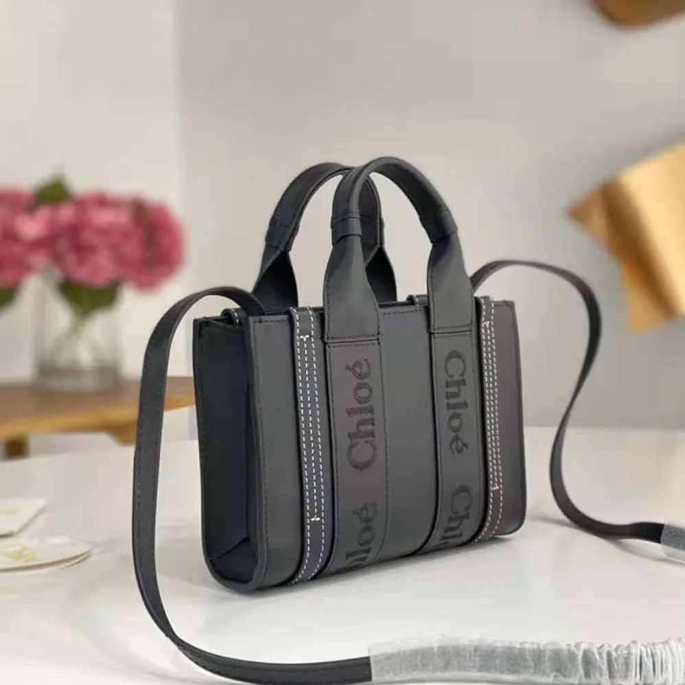 Chloe Mini Woody Tote Bag with Embroidered Chloé Logo for Women in Black Chloe Mini Woody Tote Bag with Embroidered Chloé Logo for Women in Black