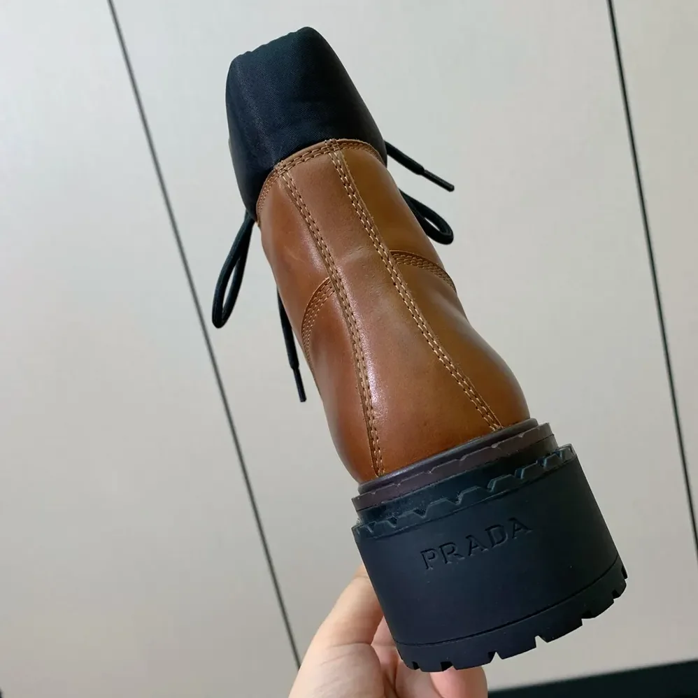 Prada Leather and Re-Nylon booties for Unisex in Ebony