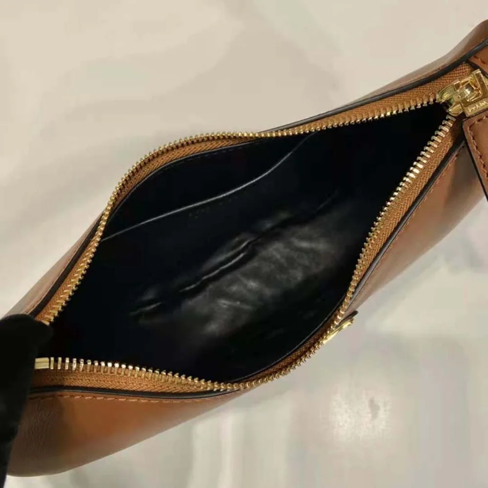 Prada Leather Shoulder Bag with Enameled Metal Triangle Logo for Women in Brown Prada Leather Shoulder Bag with Enameled Metal Triangle Logo for Women in Brown