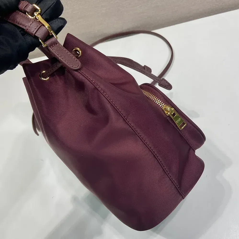 Prada Duet Re-Nylon Bucket Bag for Women in Maroon Prada Duet Re-Nylon Bucket Bag for Women in Maroon