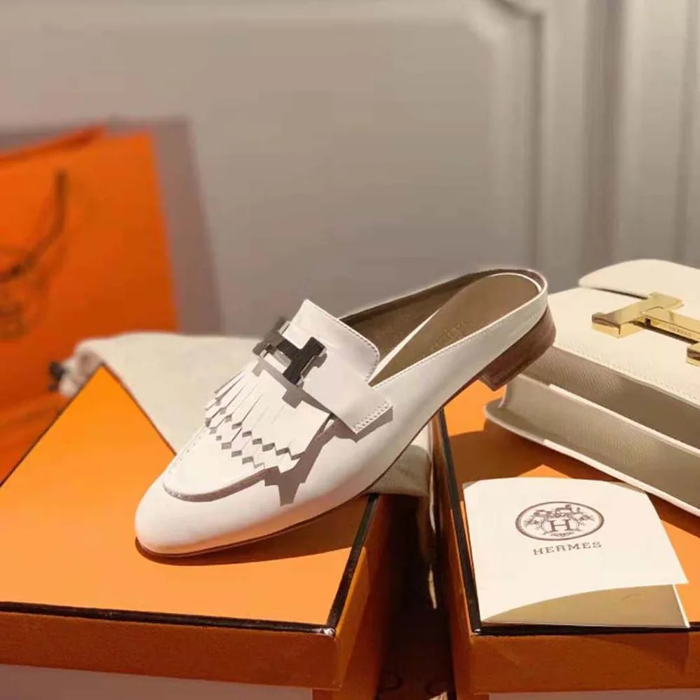 Hermes Rivoli Mule Mule in Calfskin with Fringe Detail for Women in White Hermes Rivoli Mule Mule in Calfskin with Fringe Detail for Women in White