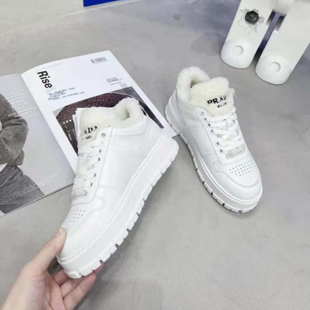 Prada Leather and Shearling Sneakers for Women in White