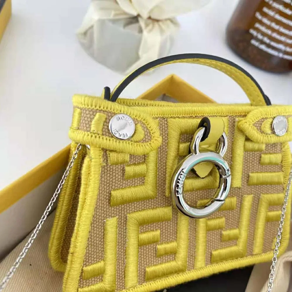Fendi Nano Peekaboo Charm Gray FF Canvas Charm for Women in Yellow Fendi Nano Peekaboo Charm Gray FF Canvas Charm for Women in Yellow