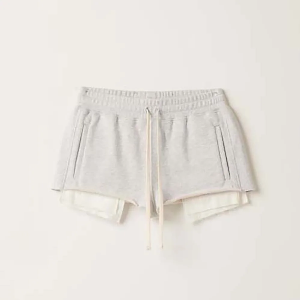Miu Miu Embroidered Cotton Fleece Shorts for Women in Silver
