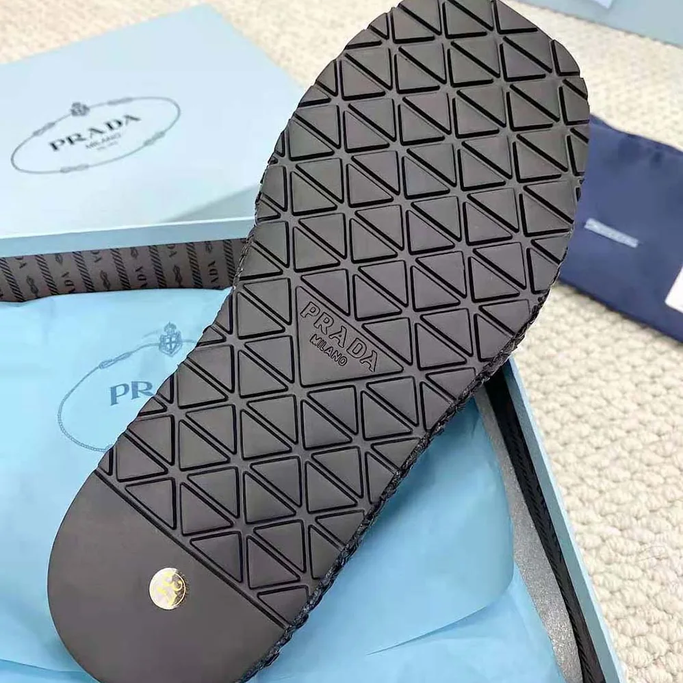 Prada Crochet Flatform Slides with Enameled Metal Triangle Logo for Women in Black Prada Crochet Flatform Slides with Enameled Metal Triangle Logo for Women in Black