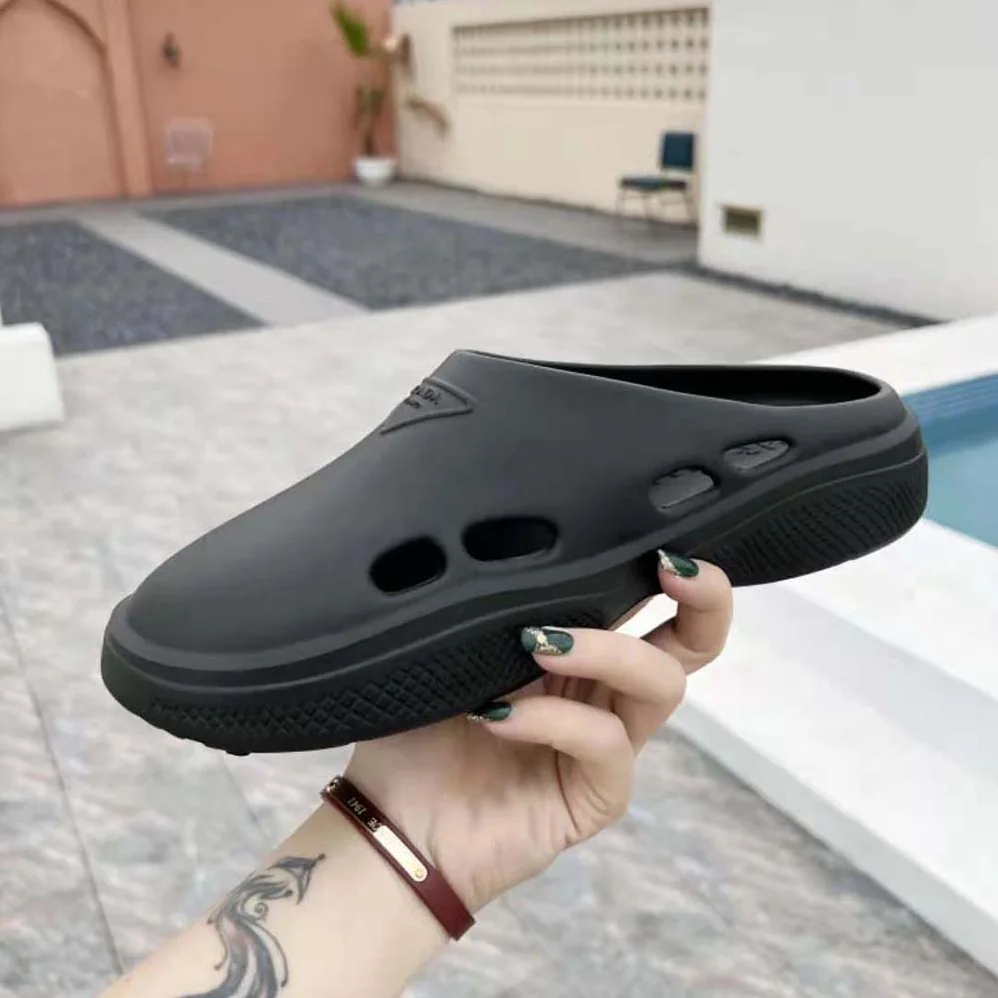 Prada Foam Rubber Mules With Embossed Rubber Triangle Logo for Women in Black Prada Foam Rubber Mules With Embossed Rubber Triangle Logo for Women in Black