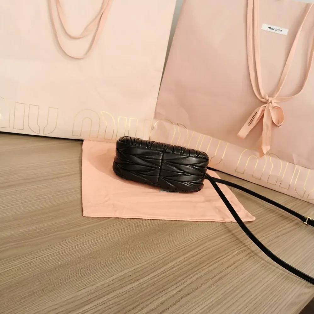 Miu Miu Wander Matelassé Nappa Leather Hobo Mini-Bag for Women in Black Miu Miu Wander Matelassé Nappa Leather Hobo Mini-Bag for Women in Black