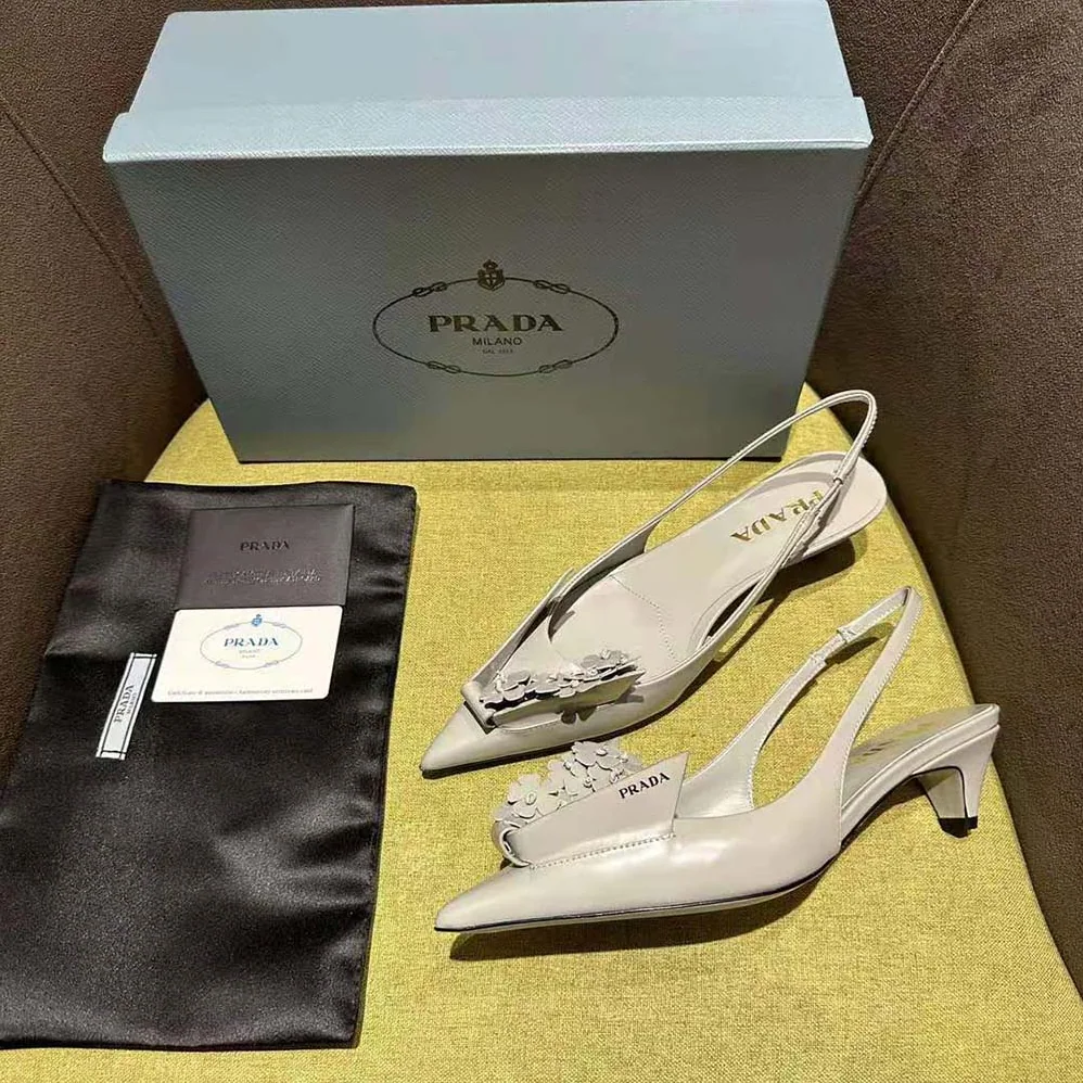 Prada Brushed Leather Slingback Pumps with Floral Appliques for Women in Gray Prada Brushed Leather Slingback Pumps with Floral Appliques for Women in Gray