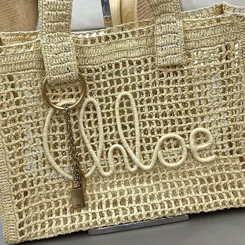 Chloe Summer Banana East-west Tote Bag in Raffia & Buffalo Leather for Women in Beige Chloe Summer Banana East-west Tote Bag in Raffia & Buffalo Leather for Women in Beige