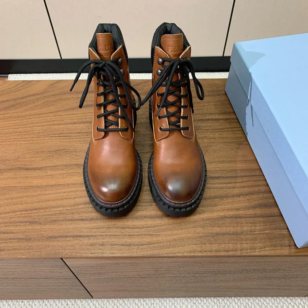 Prada Leather and Re-Nylon booties for Unisex in Ebony