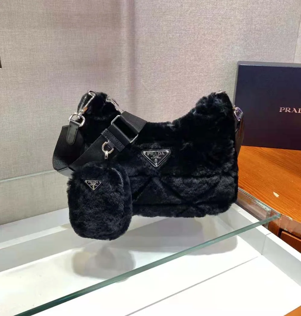 Prada A Patchwork-style Triangle Motif Characterizes Shearling Shoulder Bag for Women in Black Prada A Patchwork-style Triangle Motif Characterizes Shearling Shoulder Bag for Women in Black