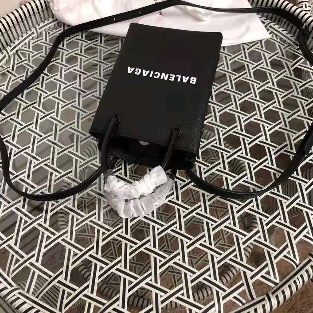 Balenciaga Shopping Phone Holder Shopping Phone Holder in Black Squared Calfskin for Unisex Balenciaga Shopping Phone Holder Shopping Phone Holder in Black Squared Calfskin for Unisex