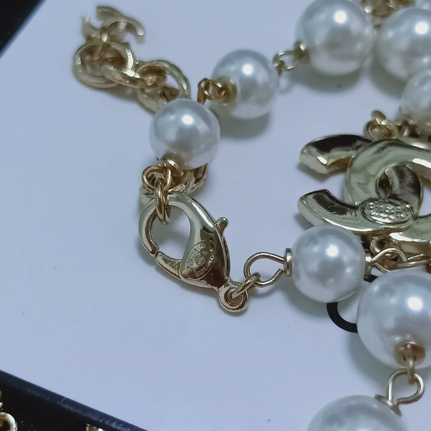 Chanel Three Chanel Iconics Pearl Necklace White Chanel Three Chanel Iconics Pearl Necklace White