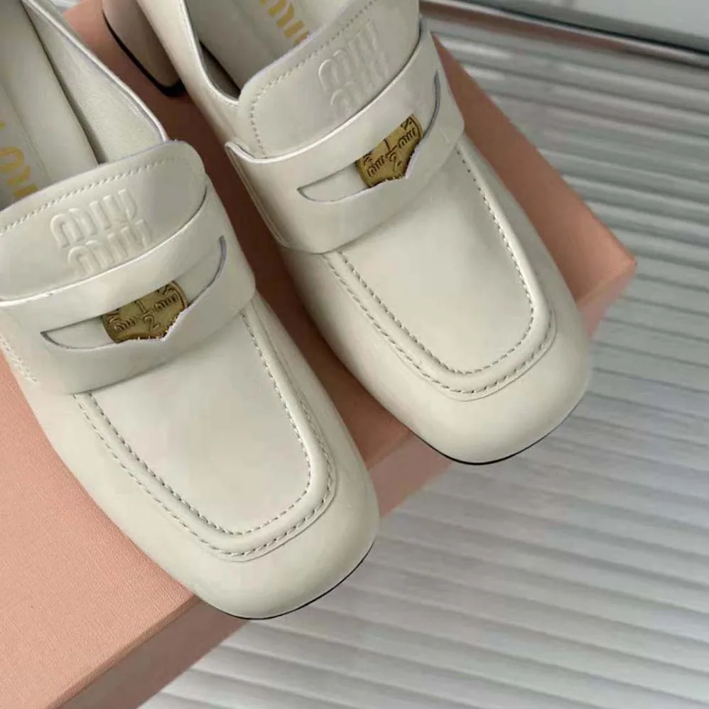 Miu Miu Patent Leather Loafers with Embossed Logo on the Tongue for Women in White Miu Miu Patent Leather Loafers with Embossed Logo on the Tongue for Women in White