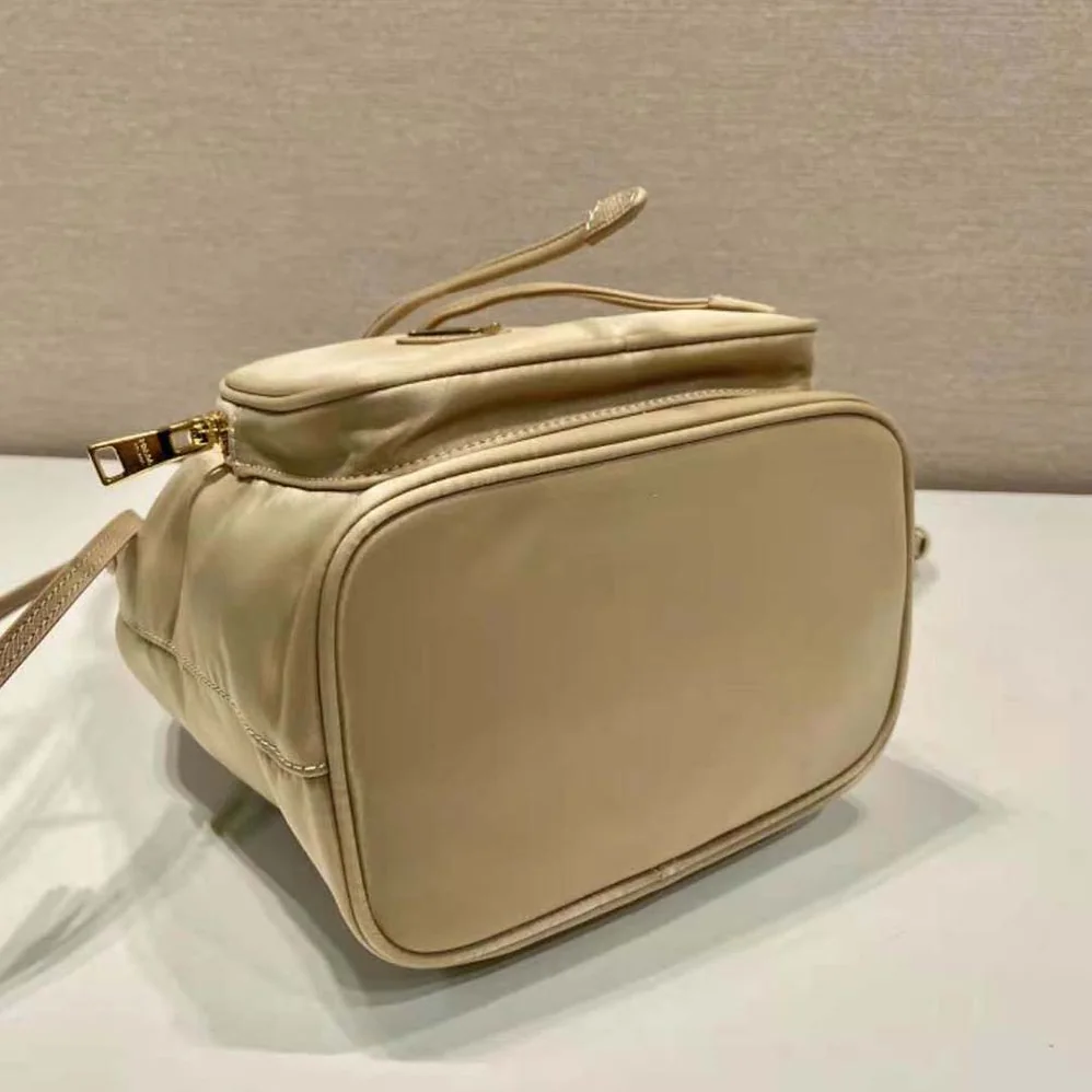 Prada Duet Re-Nylon Bucket Bag for Women in Beige