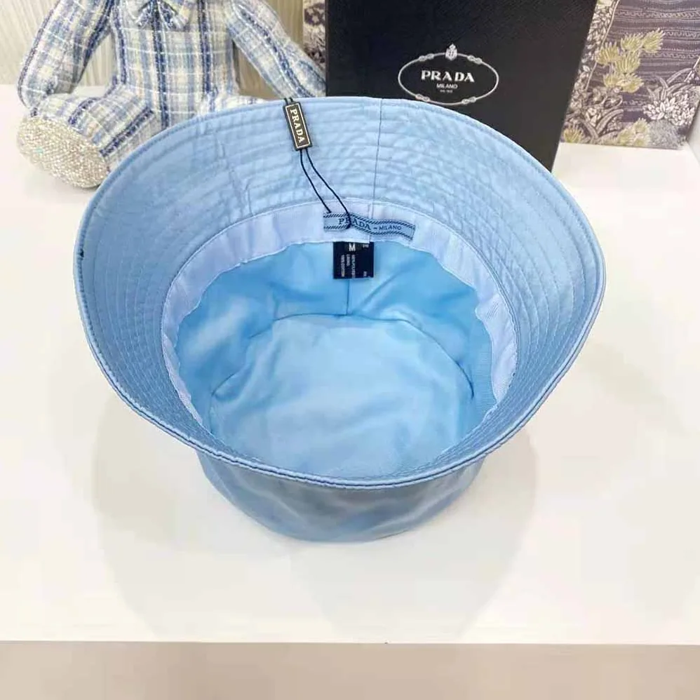 Prada Nylon Bucket Hat Decorated with the Triangle Logo for Women in Blue Prada Nylon Bucket Hat Decorated with the Triangle Logo for Women in Blue