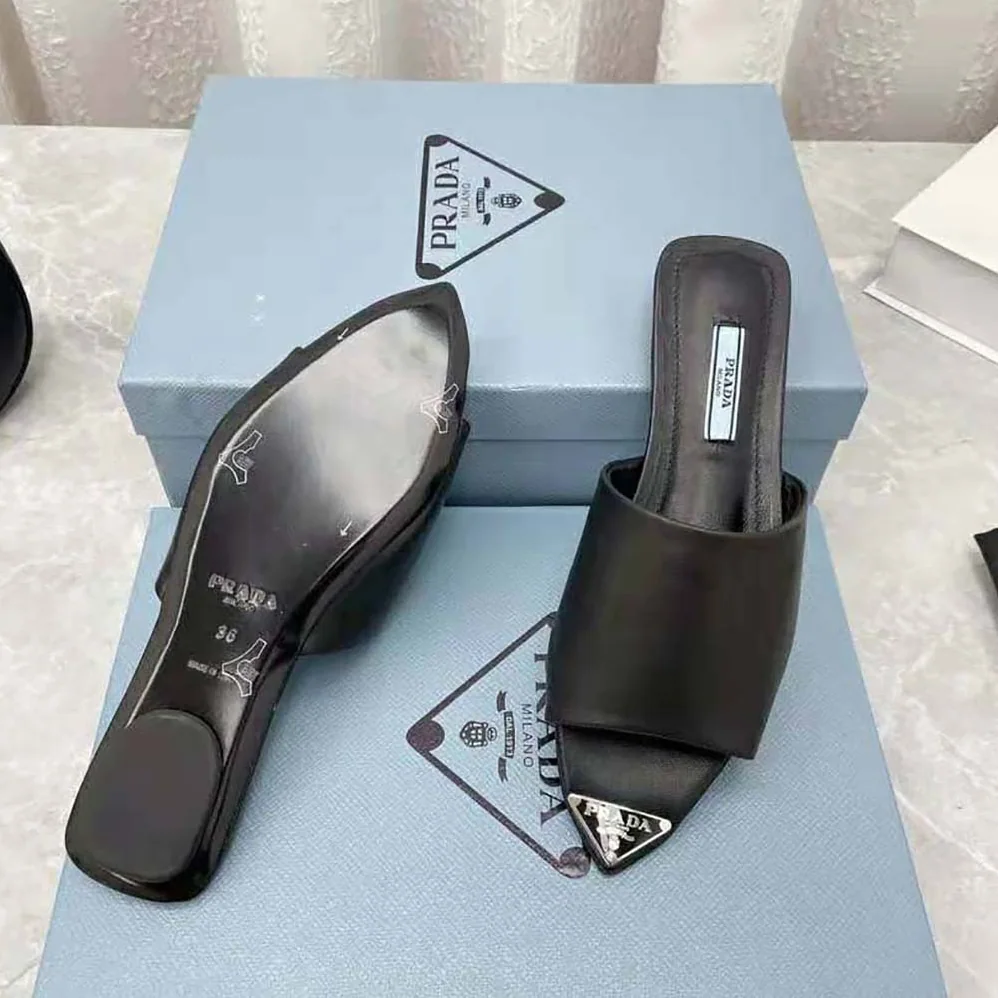 Prada Brushed Leather Slides with a Modernist Line Feature an Unexpected for Women
