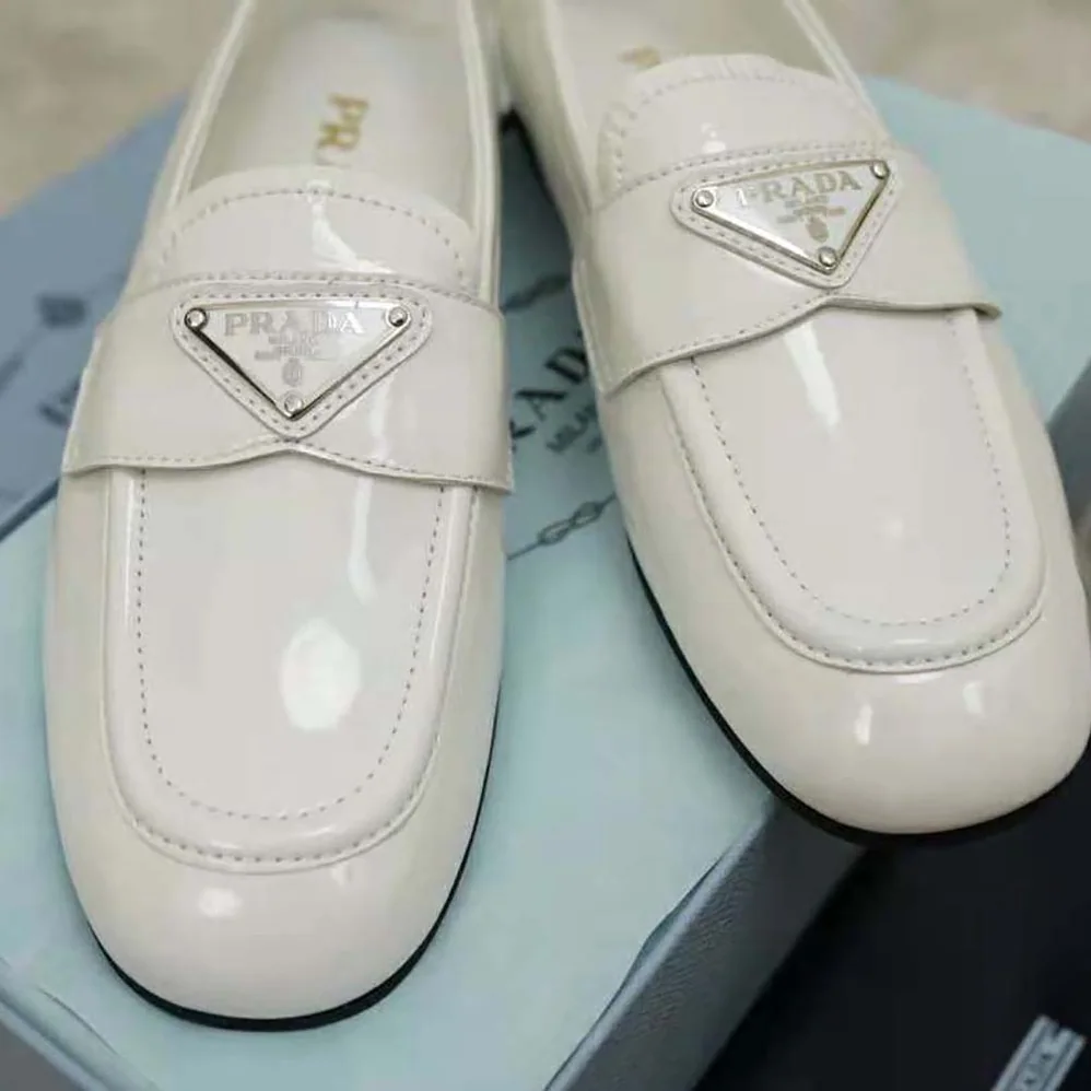 Prada Patent Leather Loafers in 5mm Heel for Women in White Prada Patent Leather Loafers in 5mm Heel for Women in White