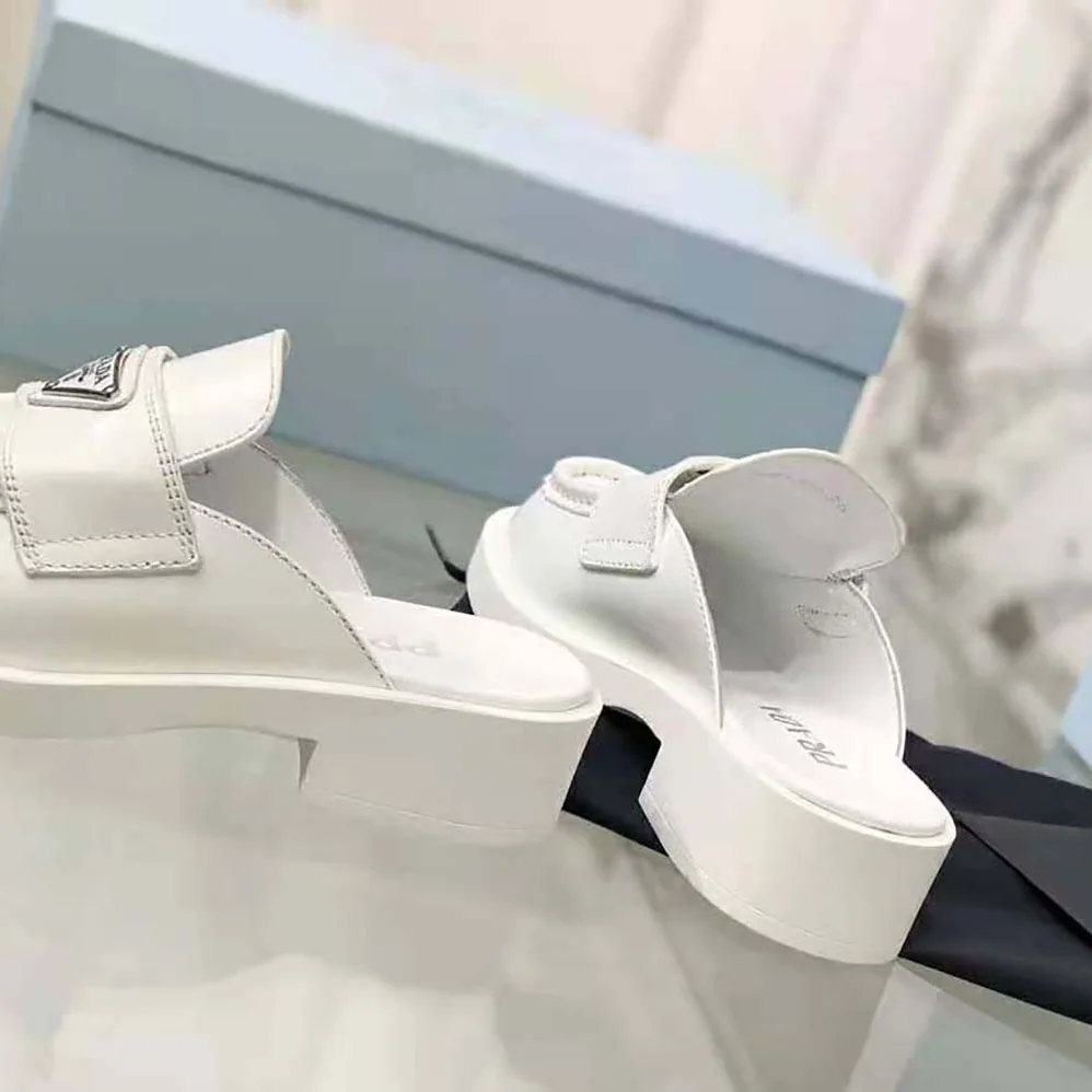 Prada Chocolate Brushed Leather Mules for Women in White Prada Chocolate Brushed Leather Mules for Women in White