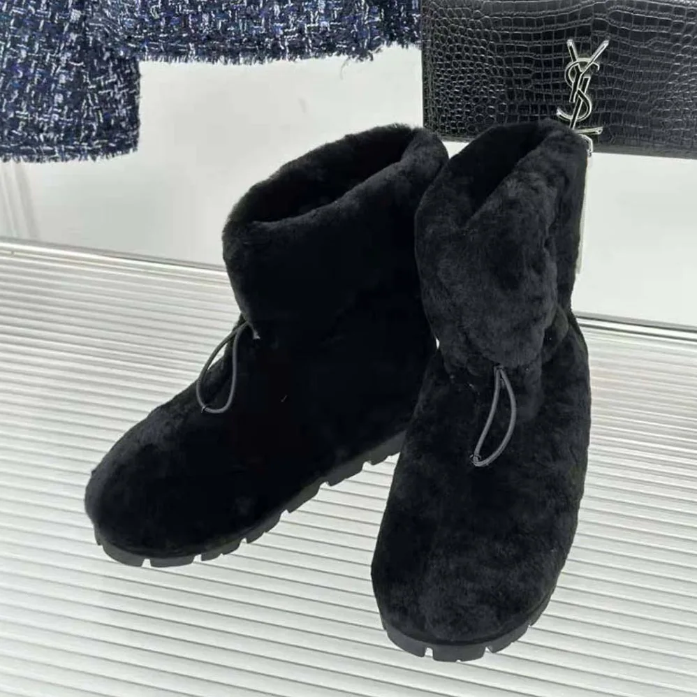 Prada Shearling Booties with Enameled Metal Triangle Logo for Women in Black