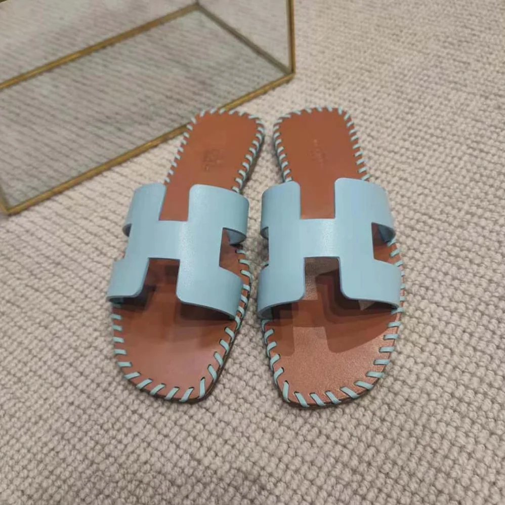 Hermes Oran Sandal in Braided Calfskin with Iconic H Cut-Out for Women in Blue Hermes Oran Sandal in Braided Calfskin with Iconic H Cut-Out for Women in Blue