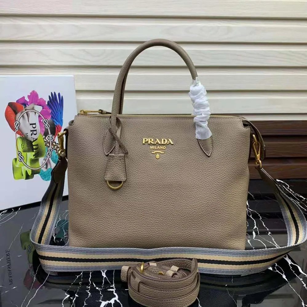 Prada Leather Handbag with Metal lettering Logo on the Front for Women in Beige Prada Leather Handbag with Metal lettering Logo on the Front for Women in Beige