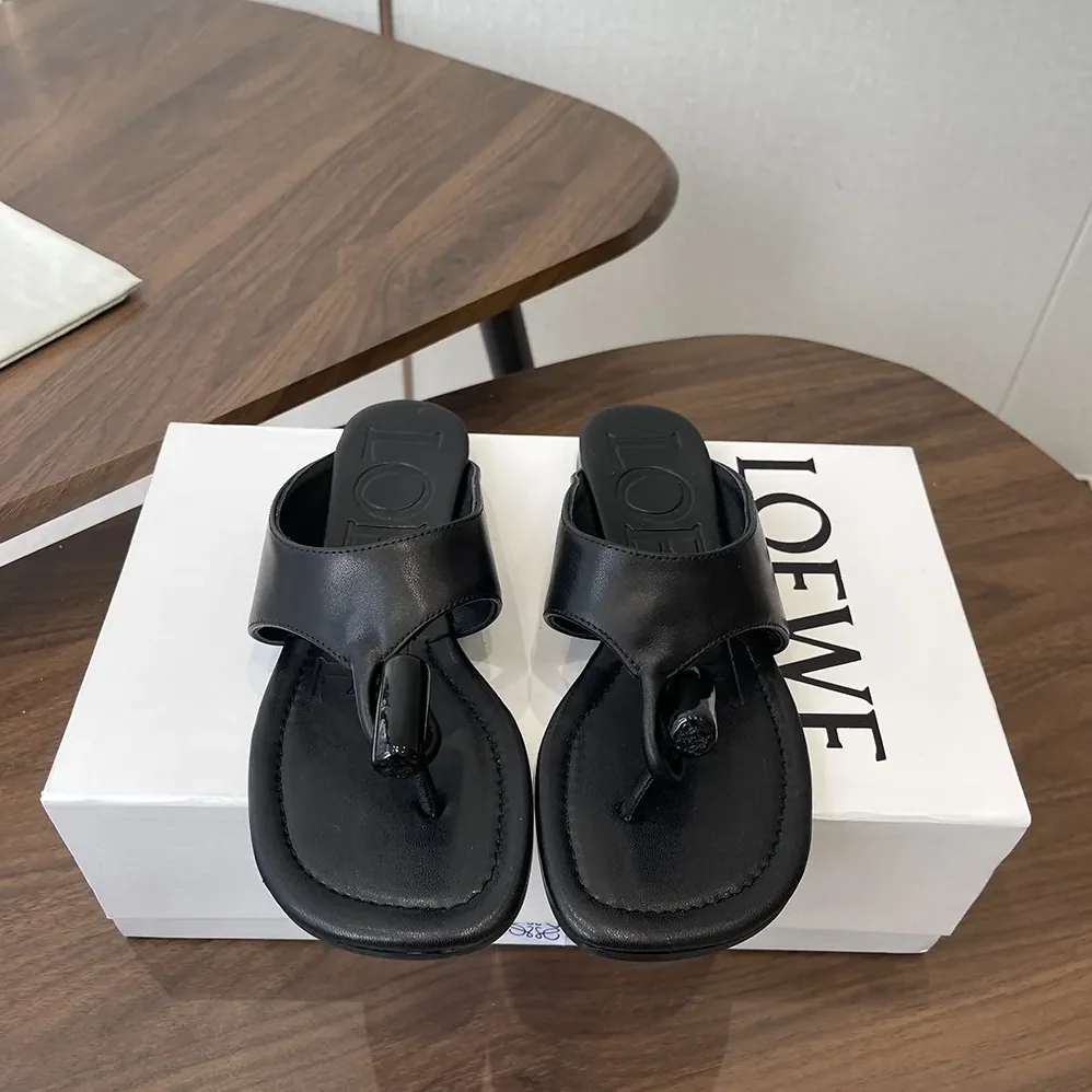 Loewe Toggle Flat Sandal in Shiny Smoot Calfskin for Women in Black Loewe Toggle Flat Sandal in Shiny Smoot Calfskin for Women in Black