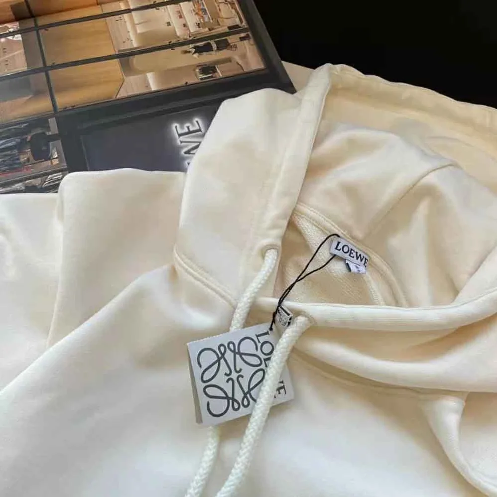Loewe Anagram Patch Hoodie in Cotton for Women in White Loewe Anagram Patch Hoodie in Cotton for Women in White