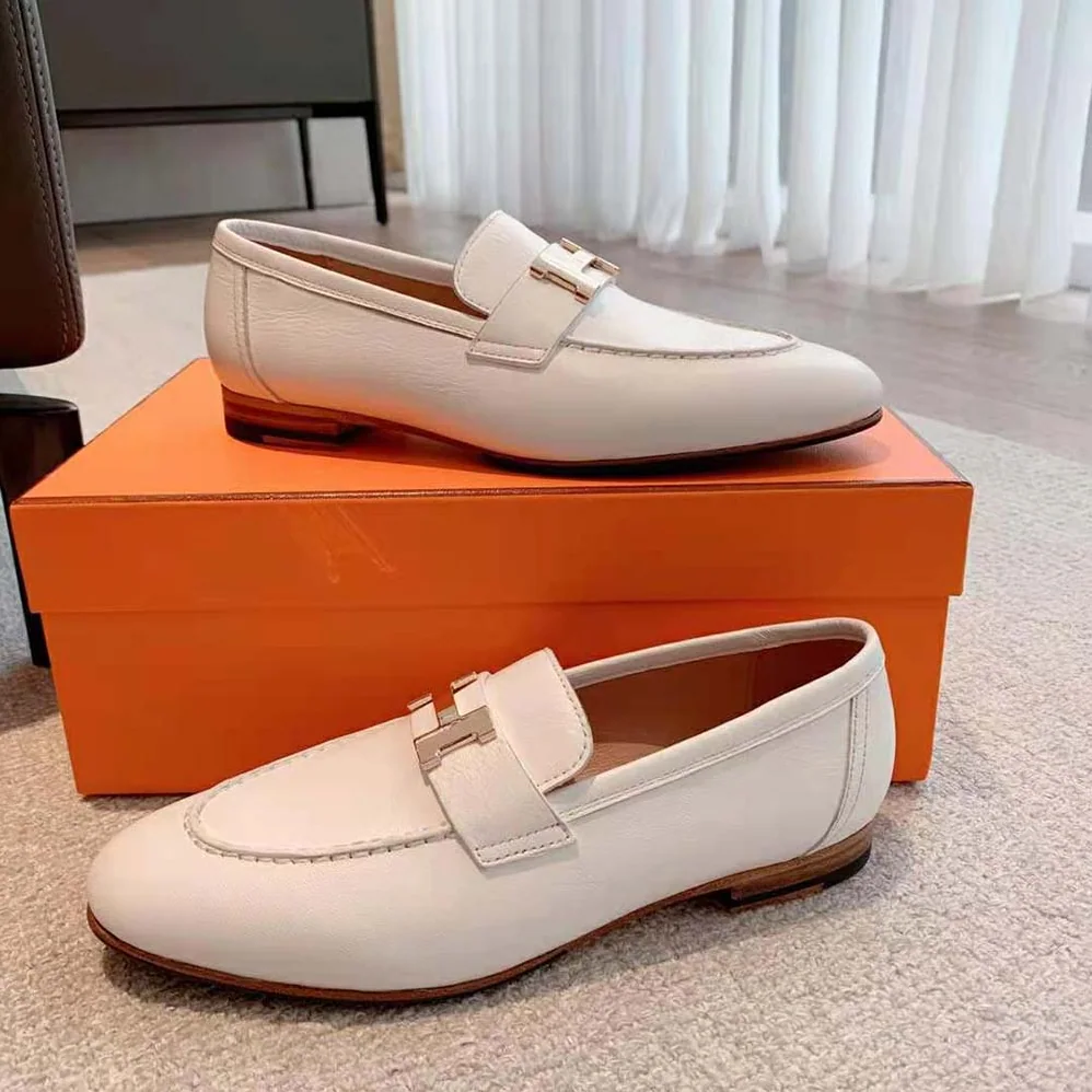 Hermes Paris Loafer in Calfskin with Palladium Plated Signature “H” Detail for Women in White Hermes Paris Loafer in Calfskin with Palladium Plated Signature “H” Detail for Women in White