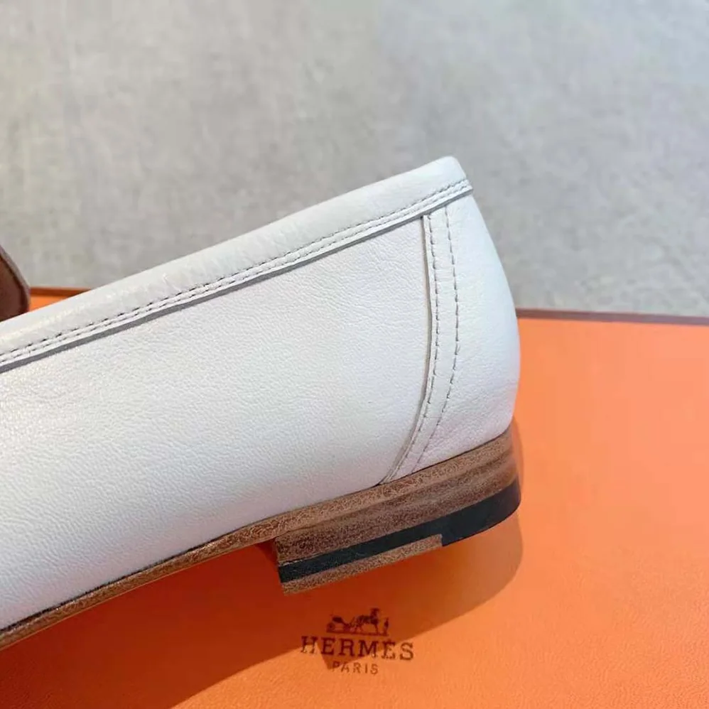 Hermes Paris Loafer in Calfskin with Palladium Plated Signature “H” Detail for Women in White Hermes Paris Loafer in Calfskin with Palladium Plated Signature “H” Detail for Women in White