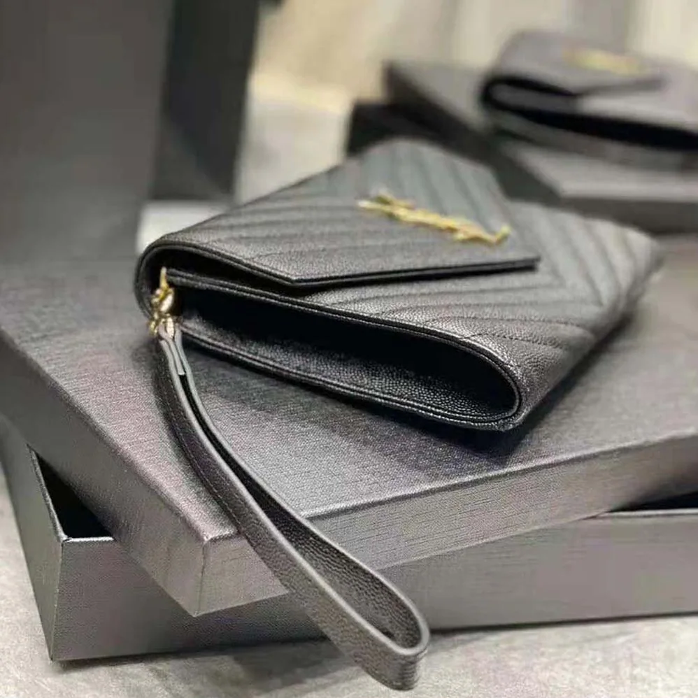 Saint Laurent YSL Monogram Clutch in Quilted Grain de Poudre Embossed Leather for Women in Black Saint Laurent YSL Monogram Clutch in Quilted Grain de Poudre Embossed Leather for Women in Black