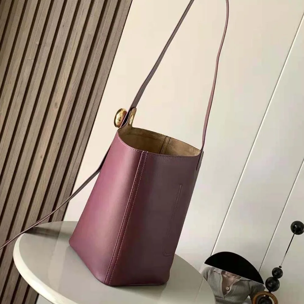 Loewe Mini Pebble Bucket Bag in Mellow Calfskin for Unisex in Maroon