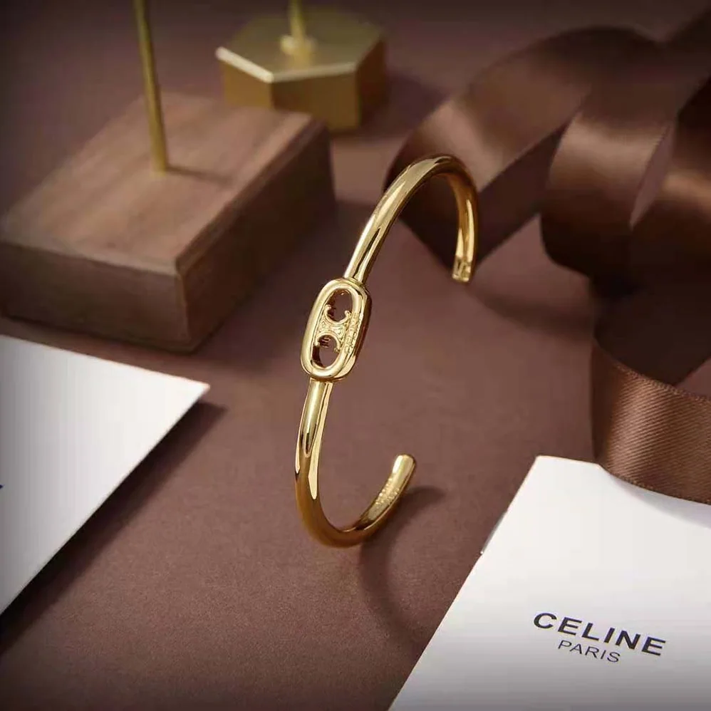 Celine Maillon Triomphe Thin Cuff in Brass with Gold Finish for Women