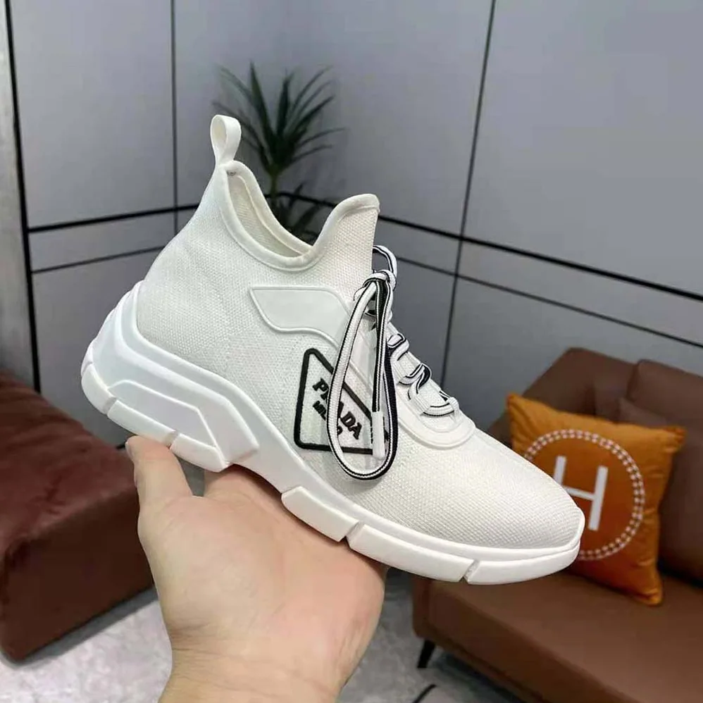 Prada The Triangle Logo Decorates These Knit Fabric Sneakers for Women in White Prada The Triangle Logo Decorates These Knit Fabric Sneakers for Women in White