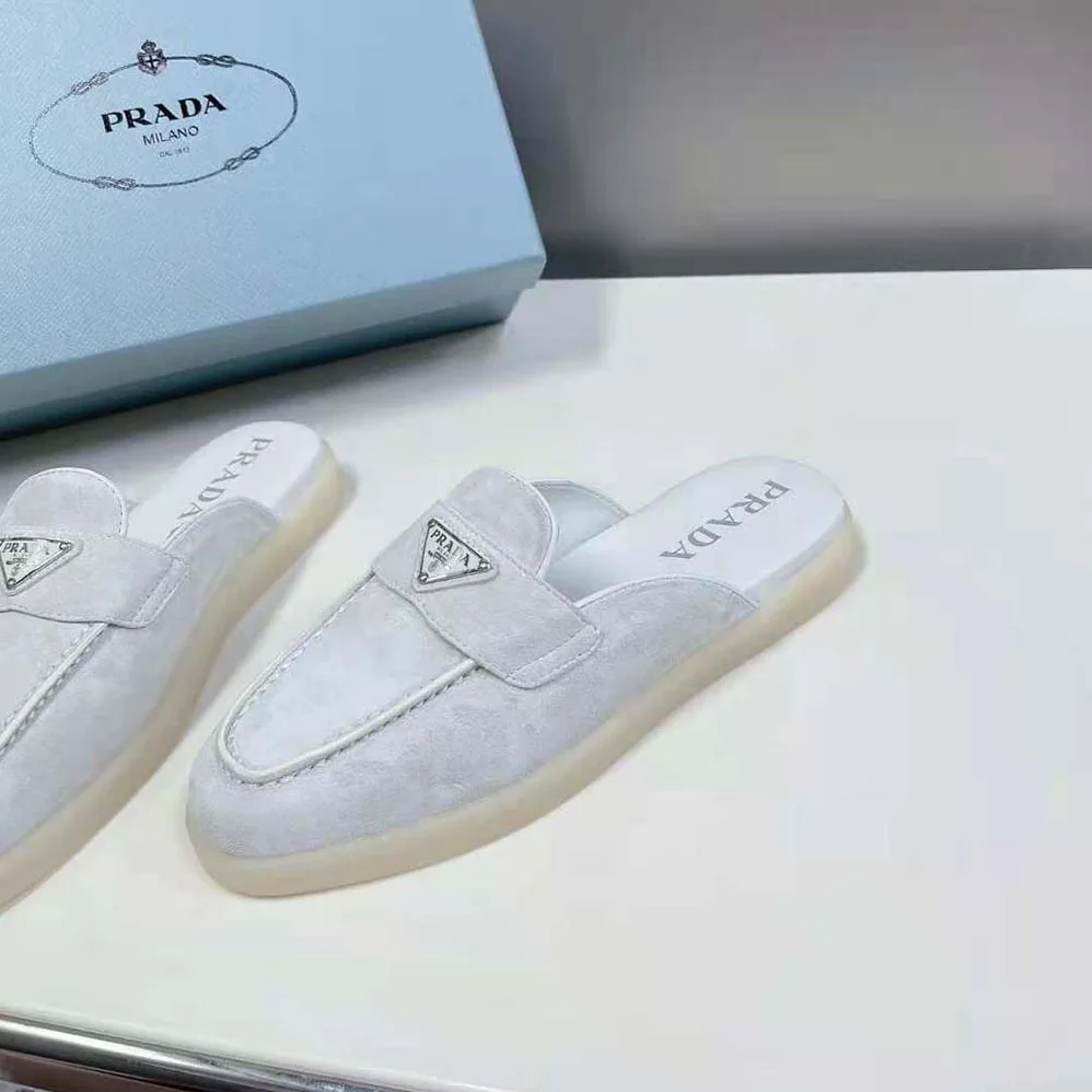 Prada Suede Leather Sabots with Enameled Metal Triangle Logo for Unisex in White