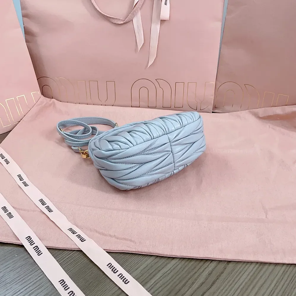 Miu Miu Wander Matelassé Nappa Leather Hobo Mini-Bag for Women in Powder Blue Miu Miu Wander Matelassé Nappa Leather Hobo Mini-Bag for Women in Powder Blue