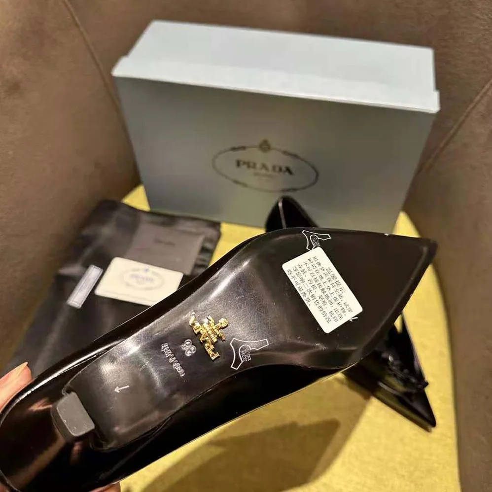 Prada Brushed Leather Pumps with Floral Appliqués for Women in Black