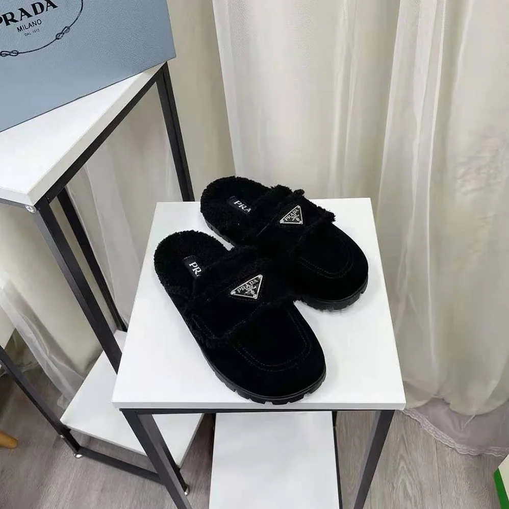 Prada Shearling Slippers Enameled Metal Triangle Logo for Women in Black