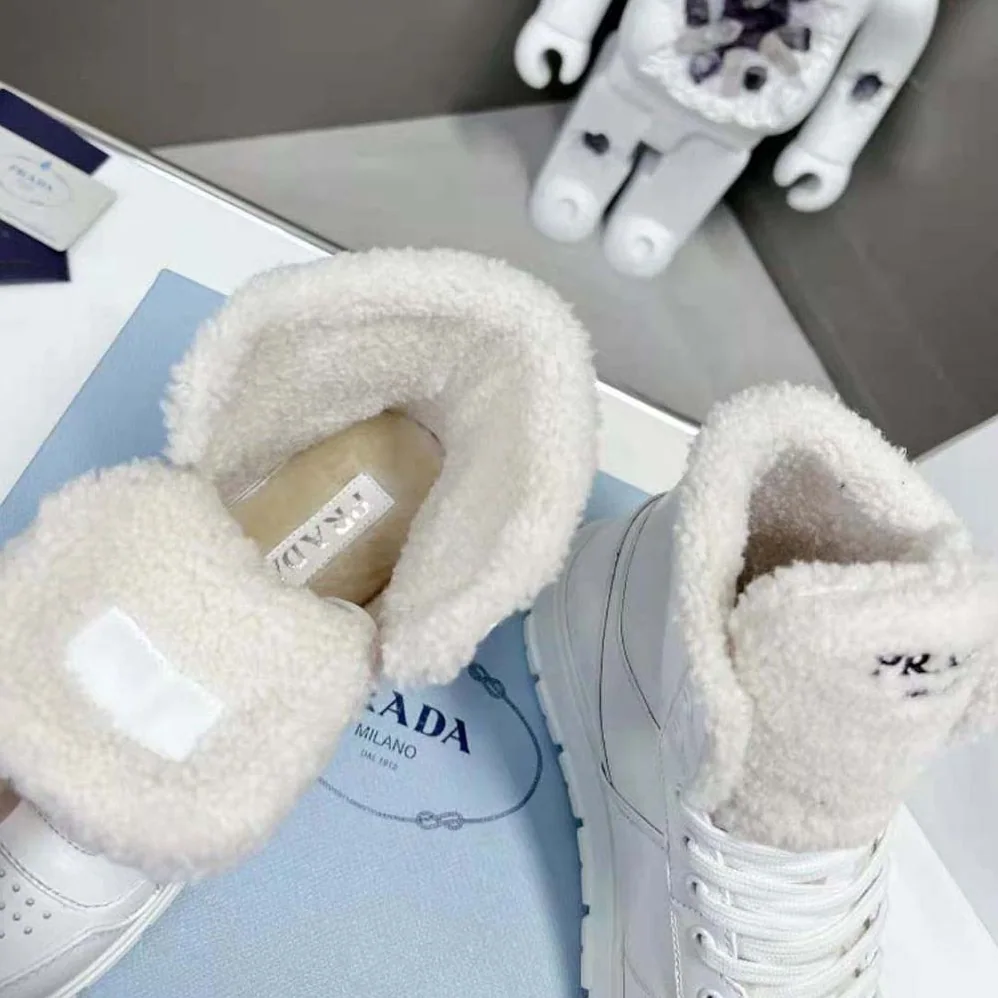 Prada Leather and Shearling High-Top Sneakers for Women in White Prada Leather and Shearling High-Top Sneakers for Women in White
