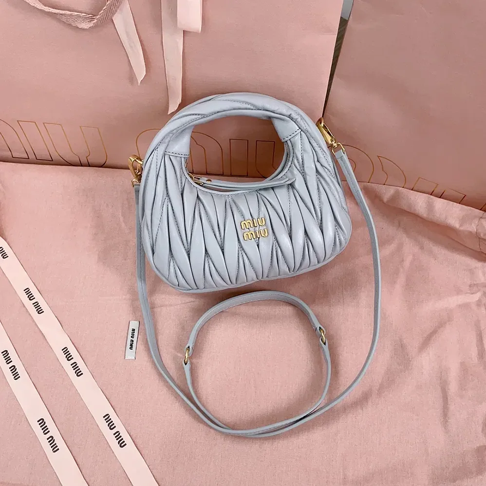 Miu Miu Wander Matelassé Nappa Leather Hobo Mini-Bag for Women in Powder Blue Miu Miu Wander Matelassé Nappa Leather Hobo Mini-Bag for Women in Powder Blue