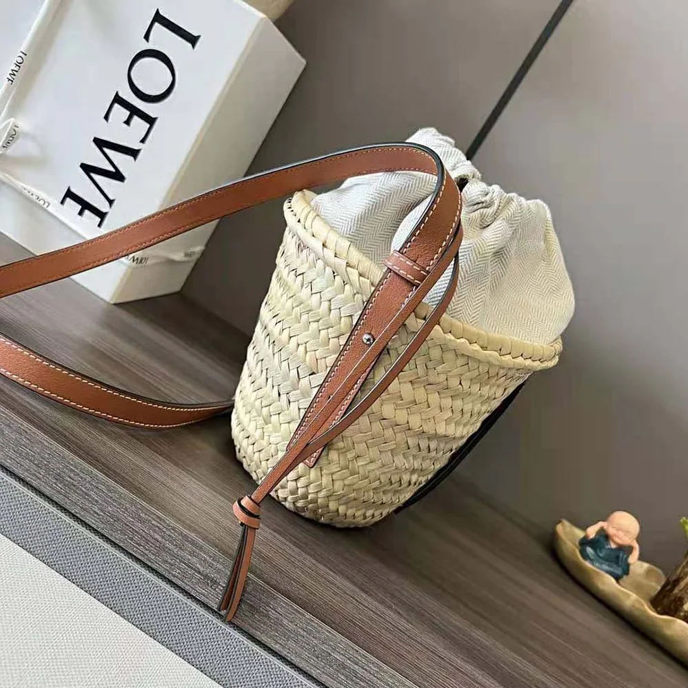 Loewe Drawstring Bucket Bag in Palm Leaf and Calfskin for Women in Brown Loewe Drawstring Bucket Bag in Palm Leaf and Calfskin for Women in Brown