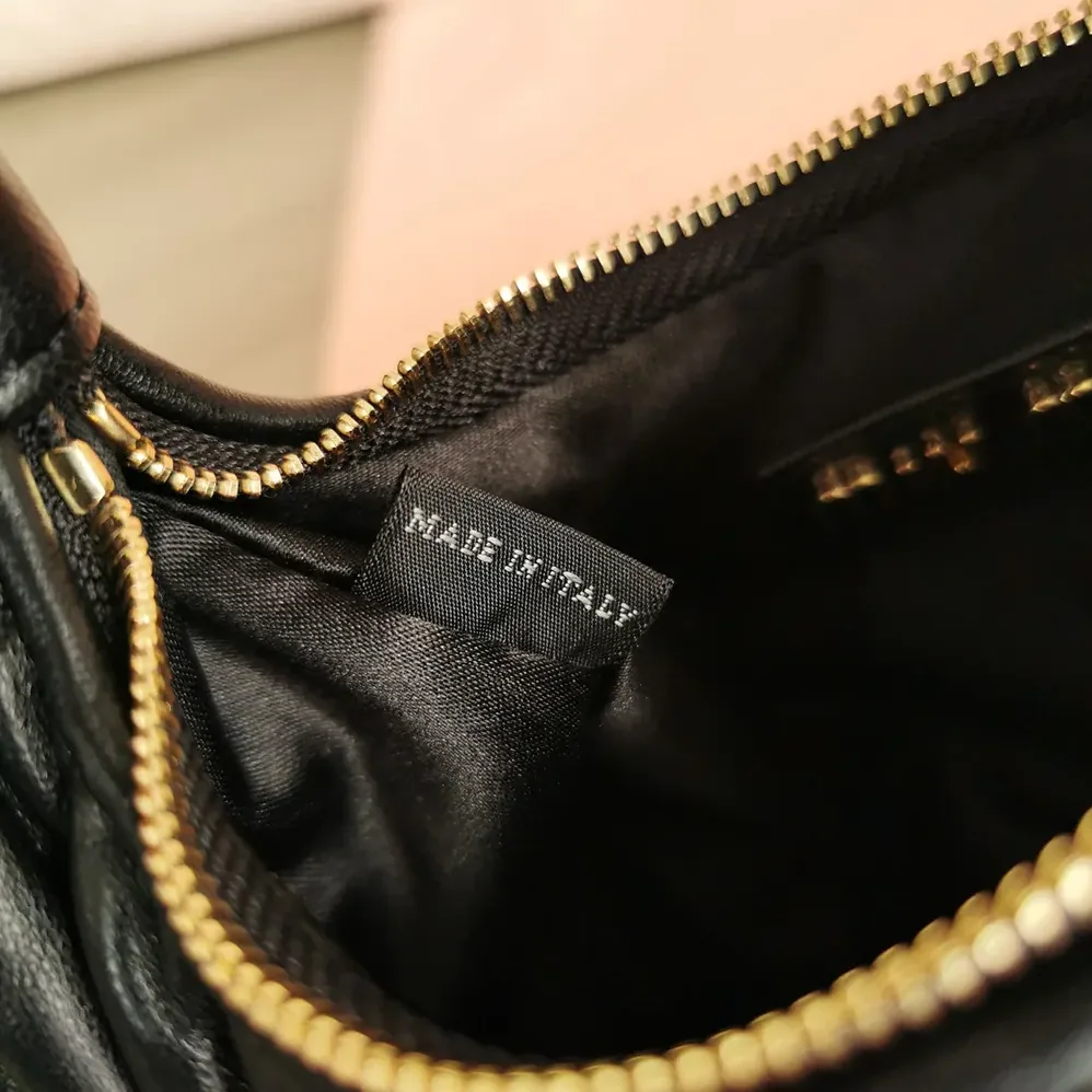 Miu Miu Wander Matelassé Nappa Leather Hobo Mini-Bag for Women in Black Miu Miu Wander Matelassé Nappa Leather Hobo Mini-Bag for Women in Black