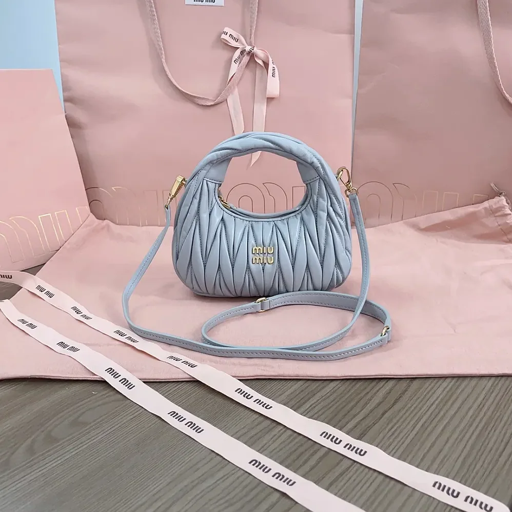 Miu Miu Wander Matelassé Nappa Leather Hobo Mini-Bag for Women in Powder Blue Miu Miu Wander Matelassé Nappa Leather Hobo Mini-Bag for Women in Powder Blue
