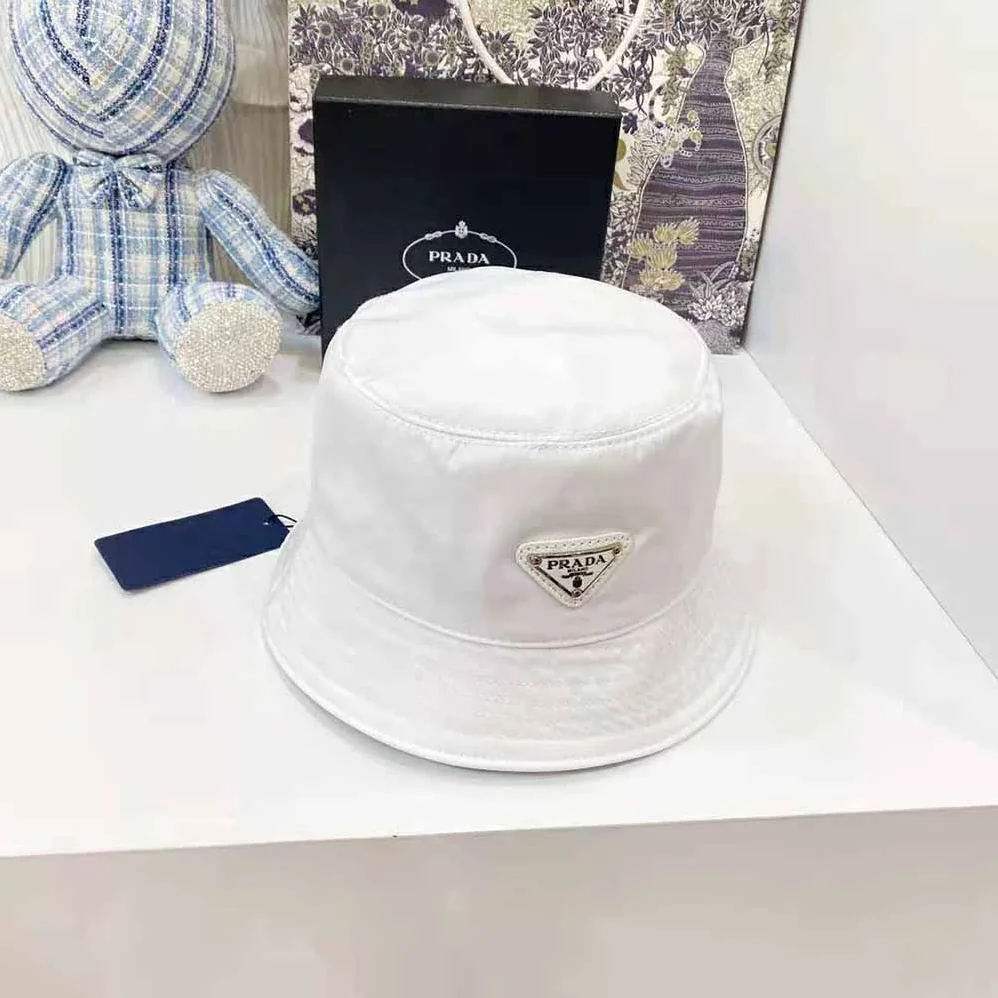 Prada Nylon Bucket Hat Decorated with the Triangle Logo for Women in White Prada Nylon Bucket Hat Decorated with the Triangle Logo for Women in White